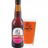 Ginette Natural Fruit in bierglas met fles ernaast